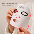 Soft, flexible silicone face mask held to show its contoured fit