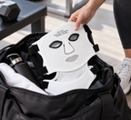 Flexible face and neck mask being packed into a gym bag