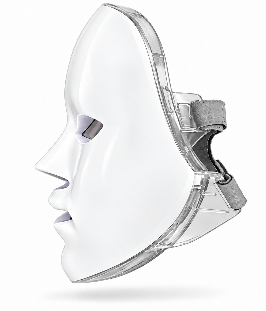 Side view of the Red Light Therapy Mask showing its white contoured shell, clear frame and grey fastening straps
