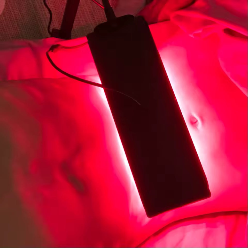 The back of the compact panel, with its red light visible around the edges.