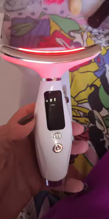 A handheld view of the wand and its illuminated curved head.