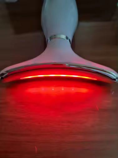 A close view of the red light strip along the head of the wand.